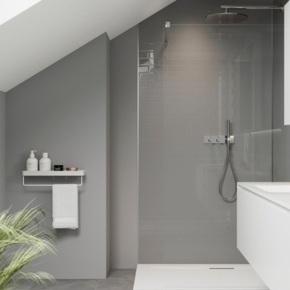 Lifestyle image of the Showerwall Compact Dove Grey 2440mm x 1220mm Tile Effect Wall Panel - SWCT01 installed in a bathroom with walk-in shower & concealed shower, shelving unit & wall-hung vanity unit.